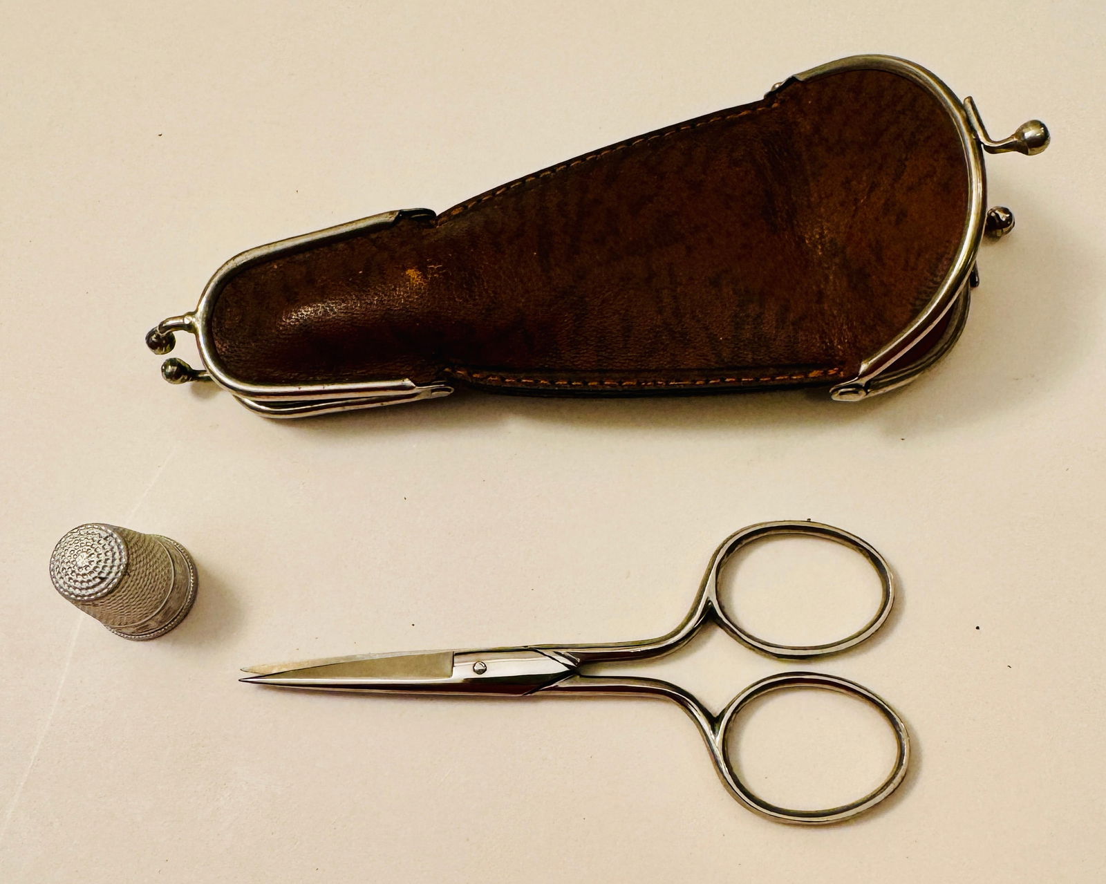 Vintage sewing scissor/thimble case: Special case that opens at both ends with scissor on one side and the thimble on the other -about 4 inches and condition is very good.