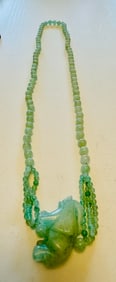 Green beaded necklace with elephant pendant