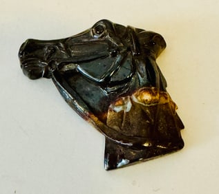 Opal horse head carved in matrix