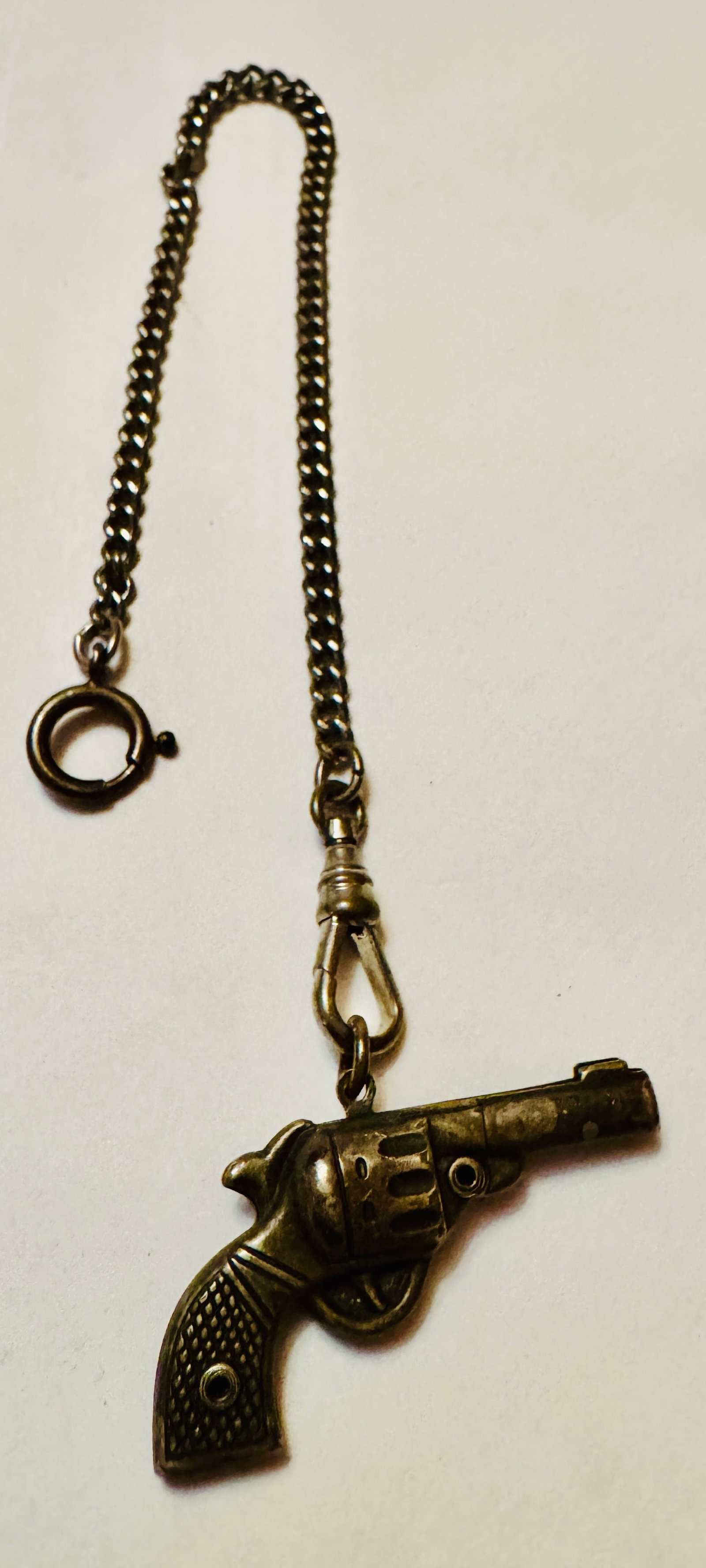 Old pistol chain/watch fob: Pistol revolver watch fob/ with chain - nice condition and about 7 inches