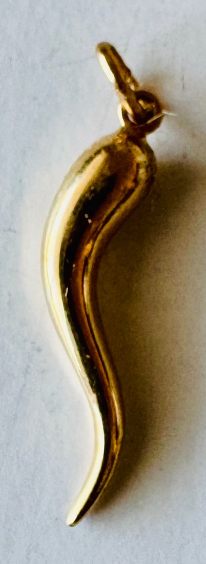 Italian horn charm 14k gold: 14k gold Italian horn charm pendant with no wear showing about 1 inch and weighs 1 g. All gold payments may be required to be wire transfer if not a regular client.