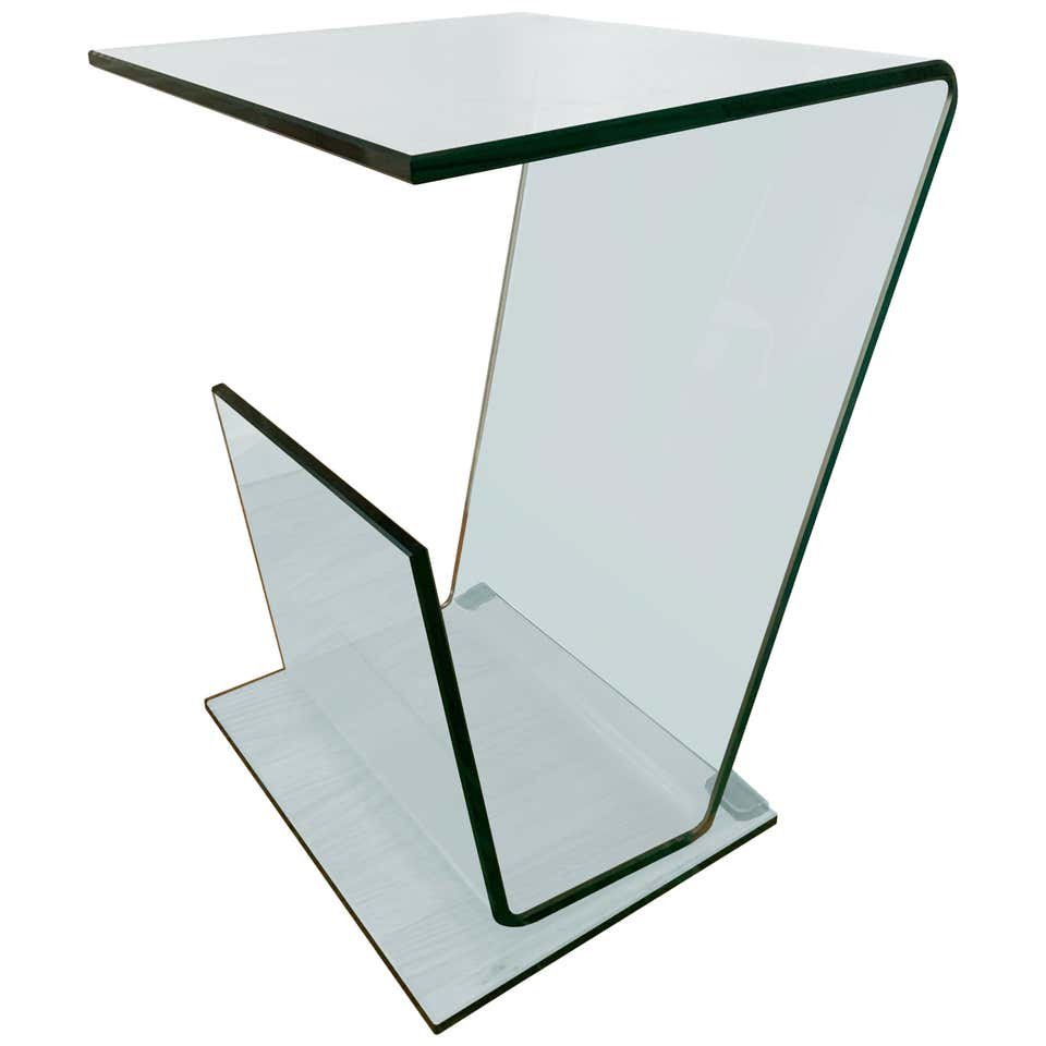 Side Table W/ a Magazine Rack in the Style of Pace: Beautiful bent glass side table with a magazine holder in the style of Pace collection, the table is very minimalistic in style and blends well in many design styles, excellent condition.Measurements: