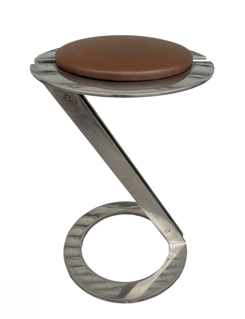 Mid Century Modern Stainless Steel Counter Stool: Mid Century modern stool made out of solid stainless steel upholstered in brown vinyl, base in great condition, seat needs to be reupholstered. Measurements: 22Â” high x 14Â” diameter seat x 14�