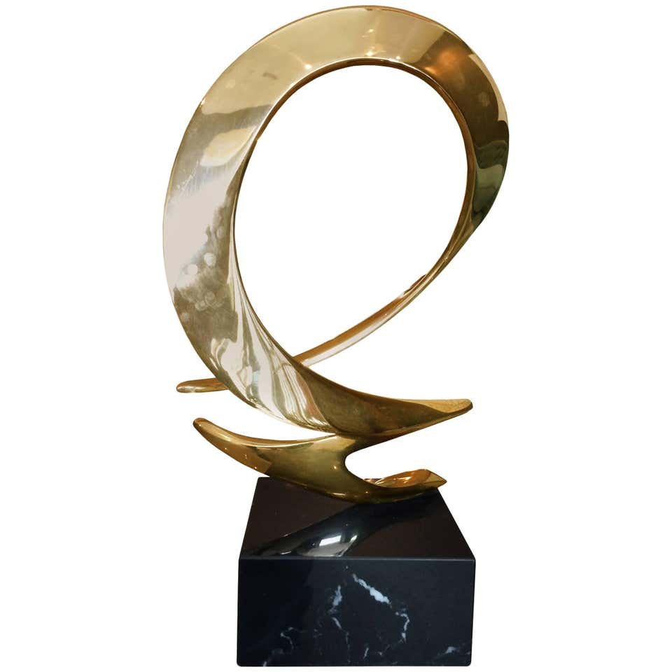 Limited Edition Bronze Sculpture by Bob Bennett: Beautiful vintage sculpture executed in bronze and sitting on a polished marble base.The free flowing lines of this sculpture are very pleasing to the eye and they make a great statement.The piece is