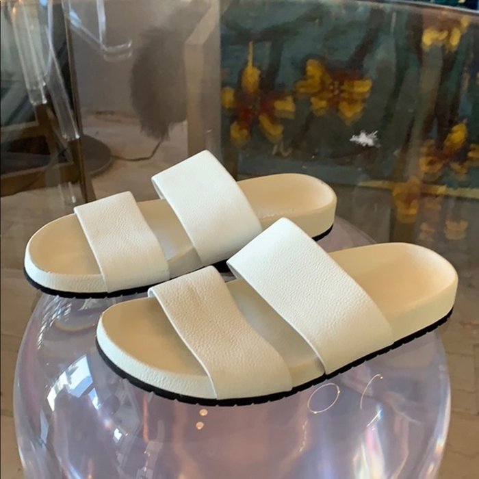 White Leather Sandals by Vince size 8B: Beautiful pair of white leather sandals designed and manufactured by Vince, size 8M, with minimal wear, a few areas have rubbing on the leather and the white has rubbed off as per photos.These are fem