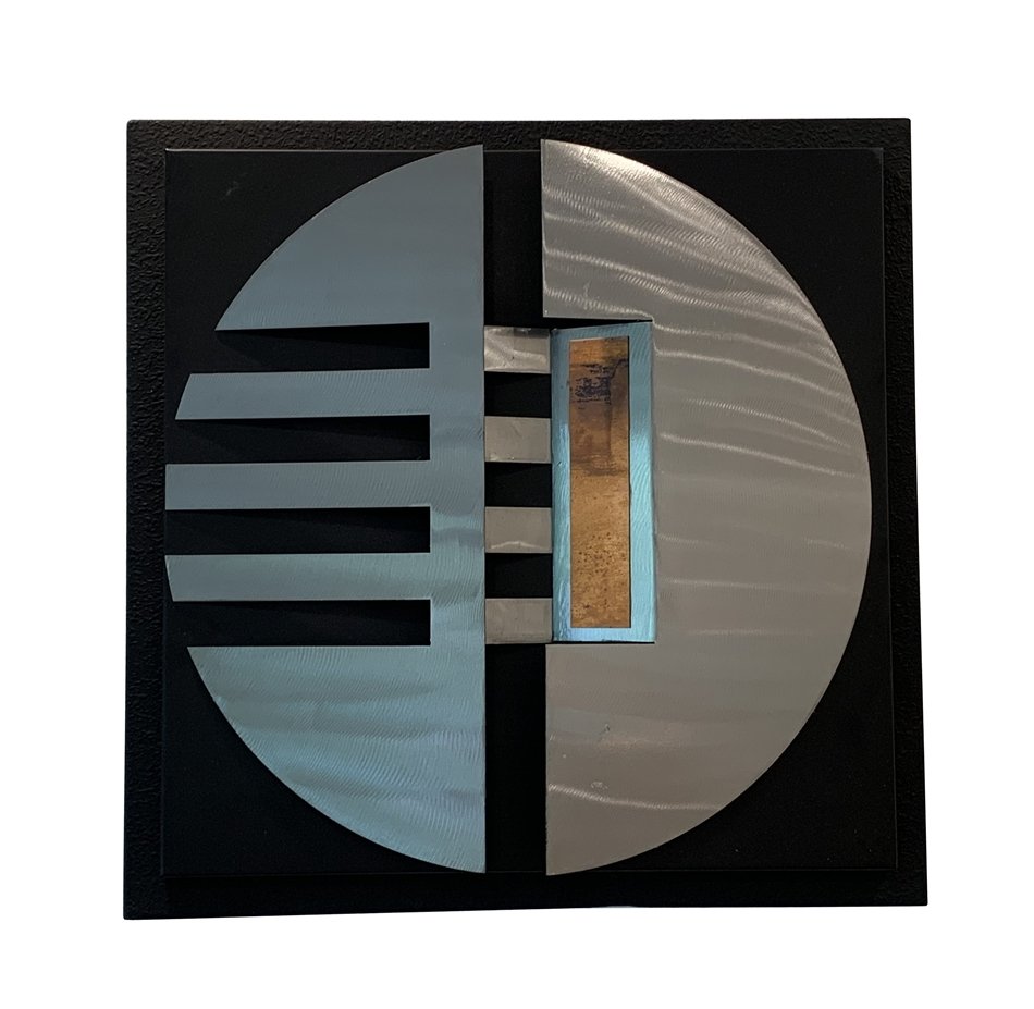 Wall Sculpture in Stainless Steel by Curtis Jere: Beautiful wall sculpture made out of stainless steel, and copper with a black frame, the piece is in good condition with only minor signs of wear. Measurements: 18 inches square x 16 disc diameter x 3