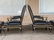 Pair of black leather armchairs and ottomans, ca 1960 - 9