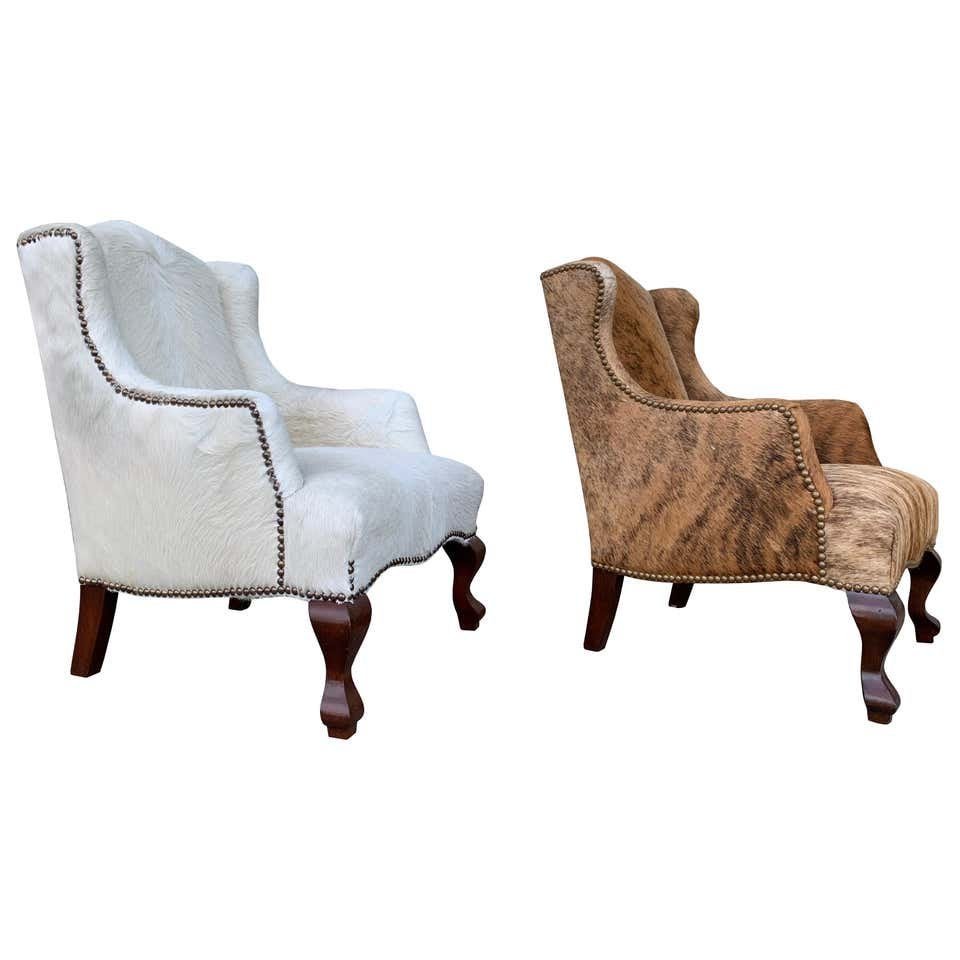 Pair of Wingback Chairs 1 in Brown 1 in white Cowhide (1 of 10)