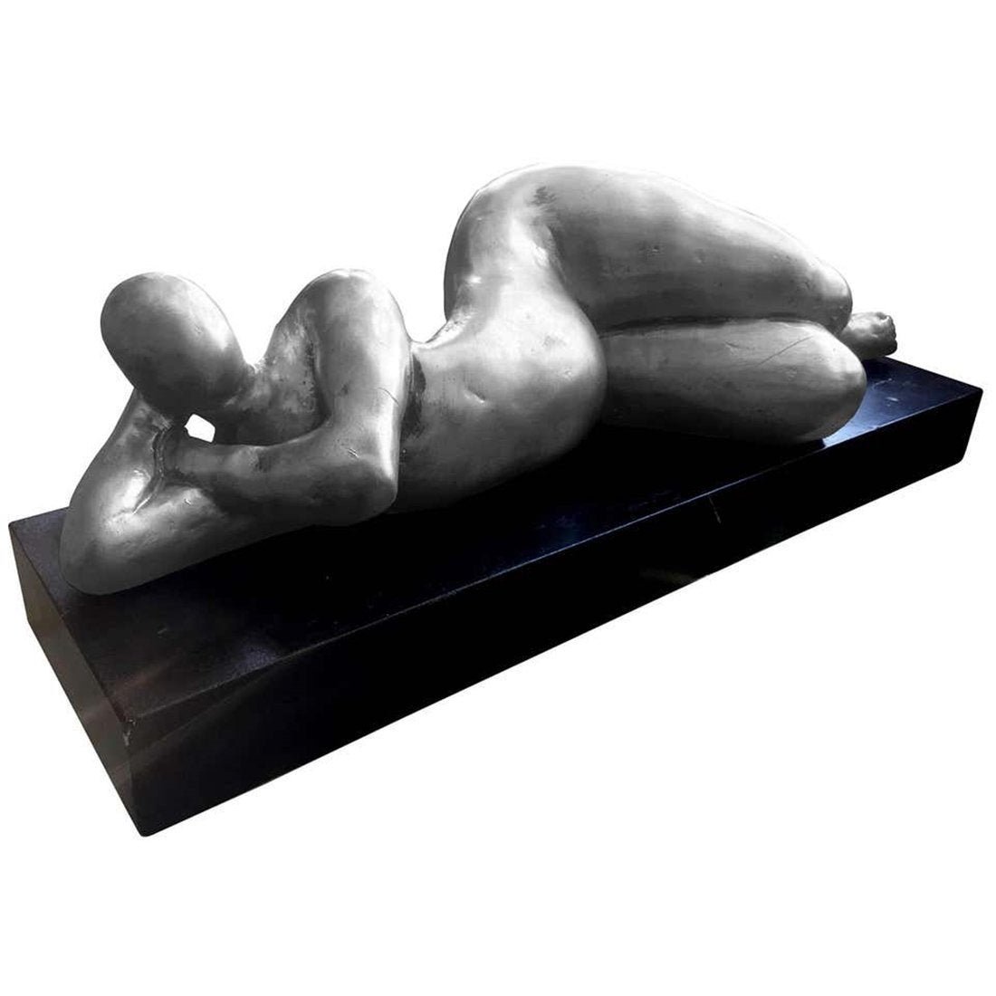 Large Table Sculpture of Nude Female by Attila Tivadar: A cast stone sculpture of a nude female by Attila Tivadar, from AttilaÃ‚Â’s Bay shore Art Studio in San Francisco. This piece depicts a female figure with exaggerated curves lying on the side wi