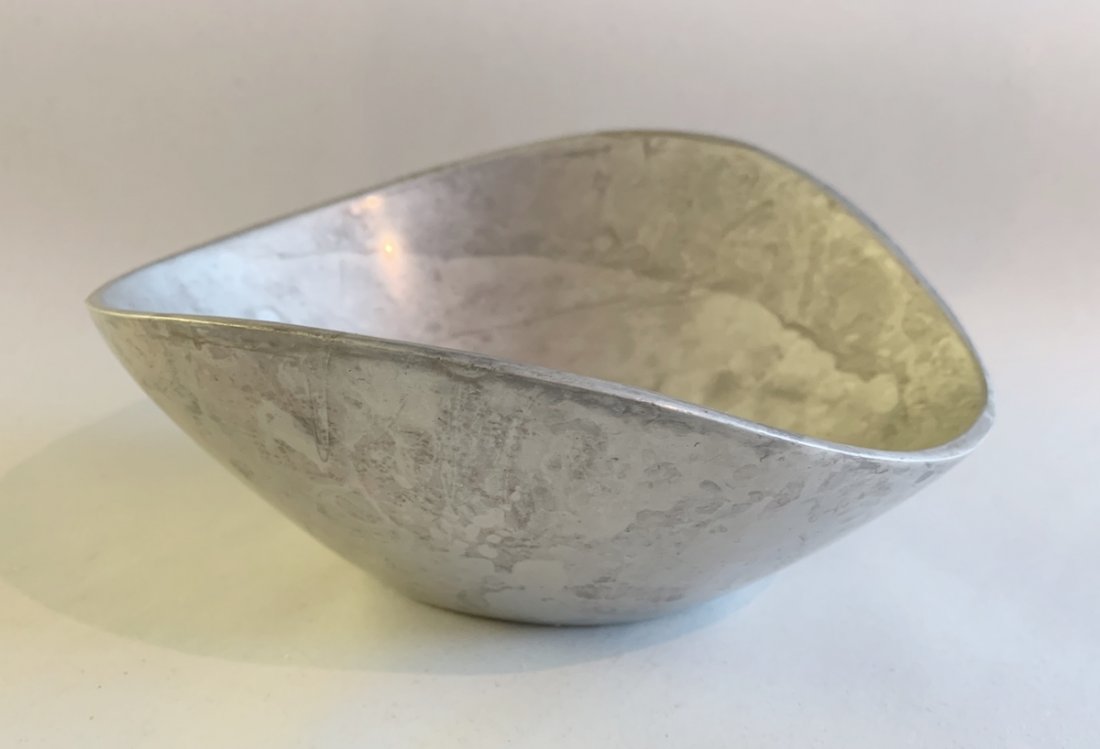 Nambe Butterfly Bowl Number 567: Among NambÃ©'s earliest designs, the Butterfly Bowl celebrates both form and function. Aesthetically pleasing to the eye, the elongated sides gracefully reach upward like wings to create its simple,
