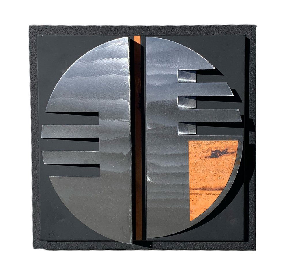 Mixed Metal Wall Sculpture by Curtis Jere: Beautiful wall sculpture made out of stainless steel, and copper with a black frame, the piece is in good condition with only minor signs of wear.Measurements:<18 inches square x 16 disc diameter x 3