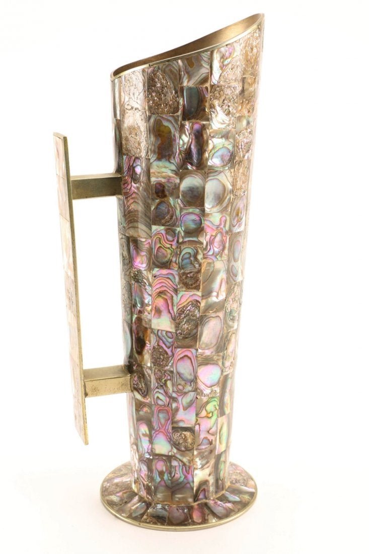 Mexican Alpaca Silver & Avalone Water Pitcher: This metal pitcher is covered with rectangular cut pieces of abalone shell along the pitcher body and handle. The pitcher is stamped -Hecho en Mexico Alpaca- to the underside.Dimensions:4.25 W x 11.25
