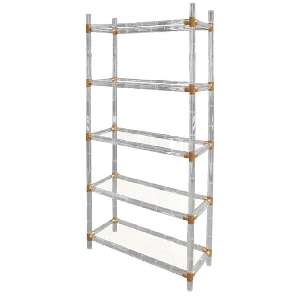 Lucite and Brass Etagere by Charles Hollis Jones Signed: Beautiful etagere/display cabinet designed and manufactured by Charles Hollis Jones in the 1960s. The etagere is only one of many pieces in this collection, we also have a bar cart available.The piece