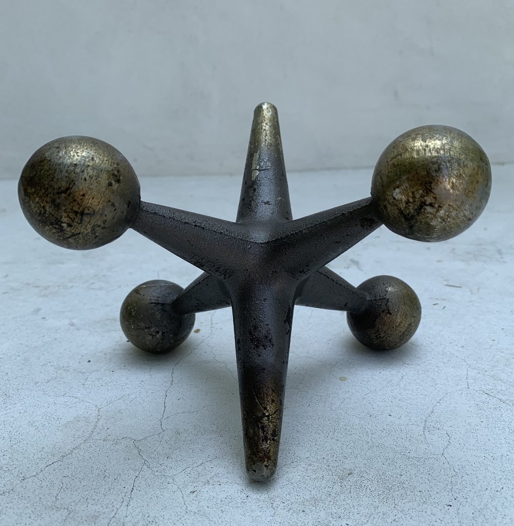 Mid-Century Cast Iron Jack Sculpture by Bill Curry: This stunning mid-century cast iron jack sculpture is stunninly beautiful. The gold metal finish on the balls and tip bestows a two-toned appeal that works in a variety of settings. Marked, Japan.Meas