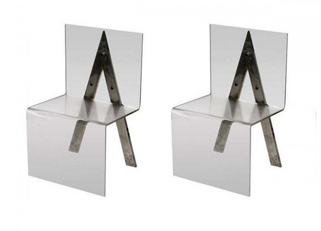 Pair of Lucite and Chrome Dining Chairs: Beautiful pair of vintage Italian dining chairs made of Lucite and steel V-Form support on back. The chairs have beautiful lines and display very well, the Lucite was professionally polished and the m