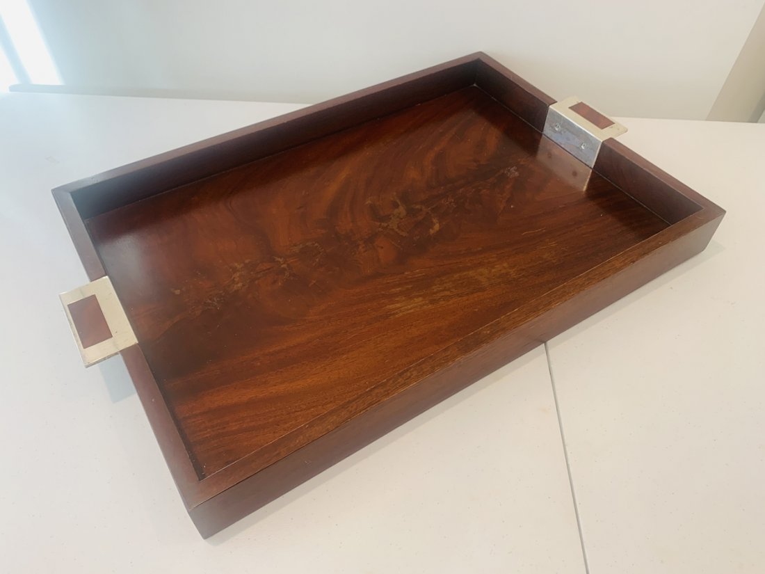 Tray in Mahogany wood & Silver Handles by Ralph Lauren: Large serving tray designed and manufactured by Ralph Lauren. The piece is made in mahogany wood with silver plate handles. The piece is in used condition and has wear to wood and scratches to handles