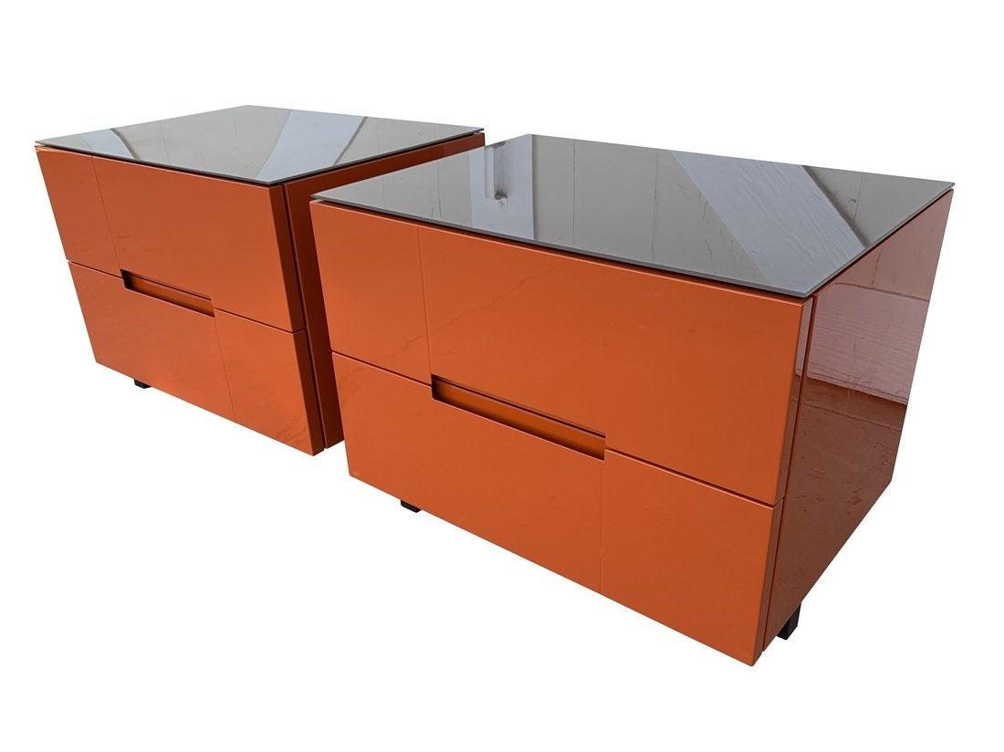 Pair of Nightstands in Orange Lacquer Finish: Beautiful pair of nightstands in orange lacqered finish, never used however one of them has some scratches on the side from when they were moved, they may be able to polish out. The piece have glass t