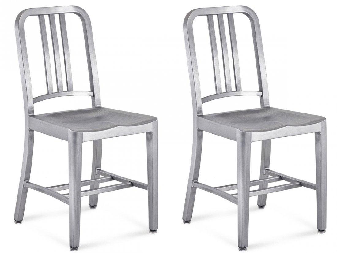 Pair of EMECO NAVY CHAIRS: First built for use on submarines in 1944, the Navy Chair has been in continuous production ever since. With the famous 77 step Process, the craftsmen take soft, recycled aluminum, hand form and weld 