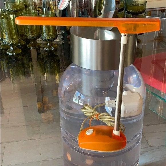 Artemide Task Lamp by E. Gismondi -Microlight-: Beautiful task/desk/reading lamp designed by Ernesto Gismondi and manufactured my Artemide.The lamp is orange in excellent working condition, height adjustable.No chip or cracks but shows wear, the sw