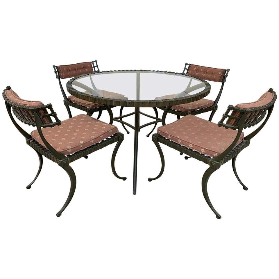 Thinline "Klismos" Dining Table and Chairs: Thinline cast aluminum Klismos dining set.Table and four chairs. Table measures: 43 3/4" round x 27" tall.Chairs measure: 20 1/2" wide x 24" deep x 29" tall. 17" from the floor to the top of the seat