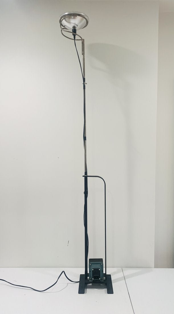 Toio floor lamp by Pier Giacomo Castiglioni, for Flos: Design Achille & Pier Giacomo Castiglioni, 1962Iron & formed steel, nickel-plated stem & car headlightMade in Italy by Flos