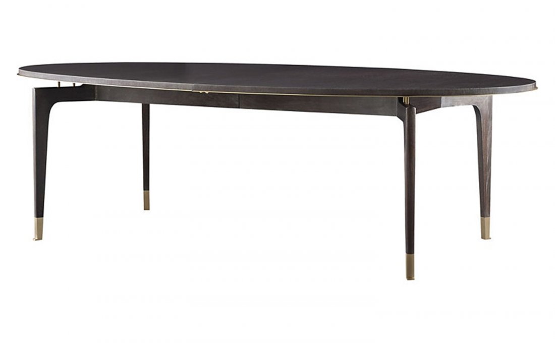 Vendome Dining Table by Thomas Pheasant for Baker: The light and airy presence of the Vendome Dining Table, shown in a Caviar finish, brings attention to the thoughtfully shaped mahogany legs with bright brass ferrule. The beautifully curved brass tri