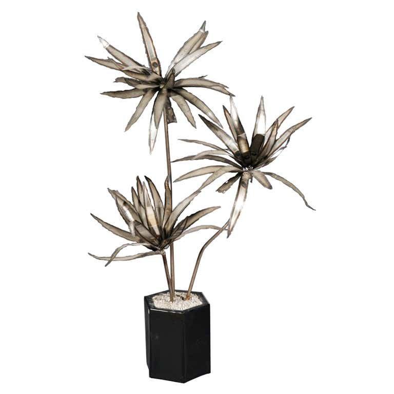 Torch Cut FlOOR Sculpture After Paul Evans 5ft,9in tall: Stunning potted metal plant made of torch cut welded steel very much in the Paul Evans style. This beautiful sculpture stands 5 feet 9 inches tall and is 42 inches wide. The sculpture is planted on an