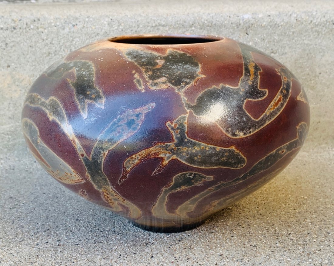 Ceramic Vase by Jim Whalen for PARADOX Pottery: JIM WHALEN for PARADOX POTTERY Vase. Large bulbous footed vase. Red clay body with brown raku firing marks. Marked. --Dimensions: 6 inches high x 8.50 inches in diameter All items are sold as is. The 
