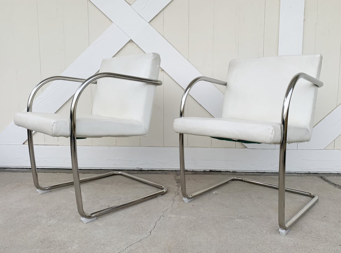 Pair of Cantilever Armchairs with Chrome Frames: Pair of cantilever armchairs with tubular frames, need new upholstery, the frames show well and are solid. Measurements: 31 inches high x 21.5 inches wide x 26.75 inches deep x 18.50 inches seat heigh