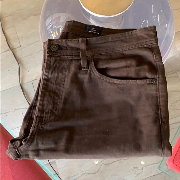 AG Adriano Goldschmied “The Protégé” size 31x28: Nice pair of Chocolate brown jeans designed and manufactured by AG Adriano Goldschmied, marked 31x34 but they have been hemmed to 28” inseam. Excellent condition, no rips, stains or holes and from a
