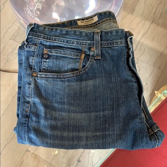 AG Adriano Goldschmied “The Protégé” Jeans 34x33: Very nice jeans from “the Protégé” collection, size 34x33, great condition, straight leg free of rips, stains or holes and from a pet and smoke free home. 9” leg opening. All items are sold as