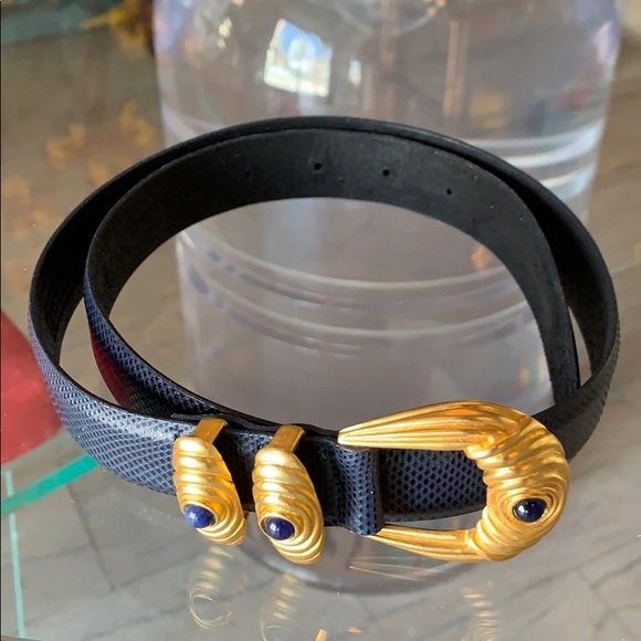 Carlisle Women’s belt made of Snake Skin sz M: Snake skin women’s belt designed and manufactured by Carlisle, size medium and new or like new condition.Navy blue and black color with a golden enamel buckle.The belt is 1” thick x 35” longAll