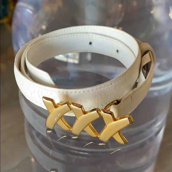 Paloma Picasso white leather belt, made in Italy: Nice white leather belt designed by Paloma Picasso and made in Italy, 3/4” wide and 34” long, three belt holes, good condition showing creasing in leather. Size medium. All items are sold as is. T
