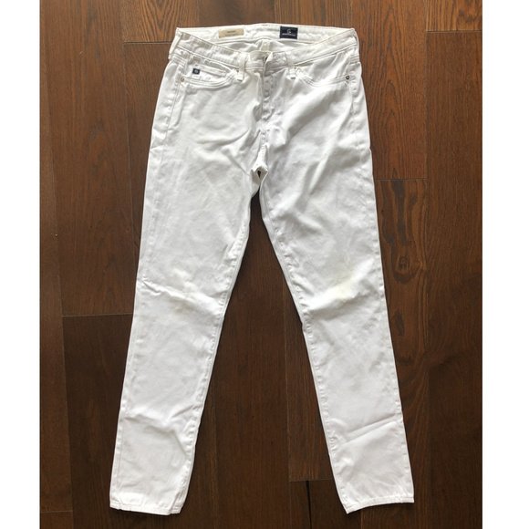 AG Adriano Goldschmied The Prima Mid-Rise Jeans: Designed and Made in Los Angeles California, USA.The Prima Ankle cigarette jean for women features a crisp white hue, fitted silhouette through the hips, slight tapering at the leg, and finished with 