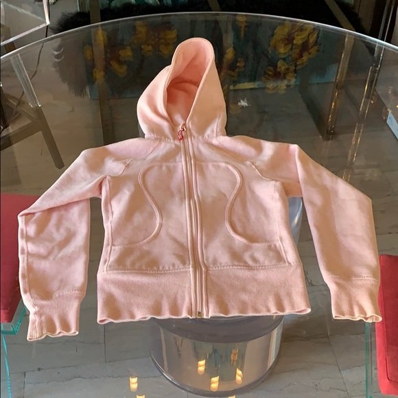 Women’s Hoodie Sweatshirt by Lululemon size 2: Beautiful sweatshirt hoodie by Lululemon, size 2, minimal wear, pink/salmon color. No rips, holes or stains and from a pet and smoke free home. 16” shoulder to shoulder x 16” across chest x 21” 