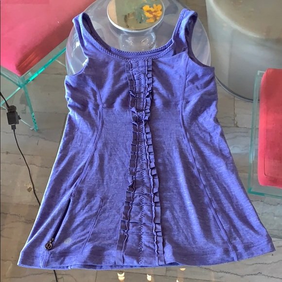 Lululemon Sleeveless Top size 4: Beautiful sleeveless workout top by Lululemon, size 4, excellent condition with mild pilling by the underarm area. No stains, rips or holes. 25” length. ANY CONDITION STATEMENT IS GIVEN AS A COURTES