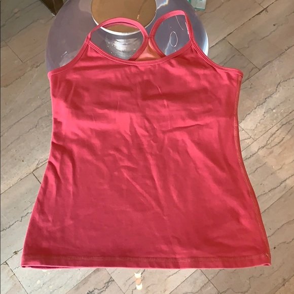 Workout Top by Lululemon in size 6, Salmon Pink: Beautiful workout top designed and manufactured in Canada by Lululemon, size 6 and in very good condition, no stains, rips or holes and from a smoke and pet free home. All items are sold as is. The au