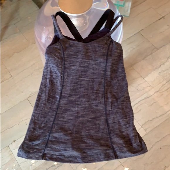 Lululemon workout top size 2: Very nice workout top by Lululemon, very good condition, no rips, stains or holes and from a let and smoke free home. All items are sold as is. The auction house does not warrant authenticity on any s