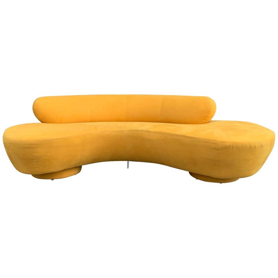 Vintage Vladimir Kagan for Directional, Serpentine Sofa: Beautiful Vladimir Kagan serpentine sofa designed in the 1970s and manufactured by Directional. The sofa retains the original label, the sofa is upholstered in a bright yellow microfiber material, the
