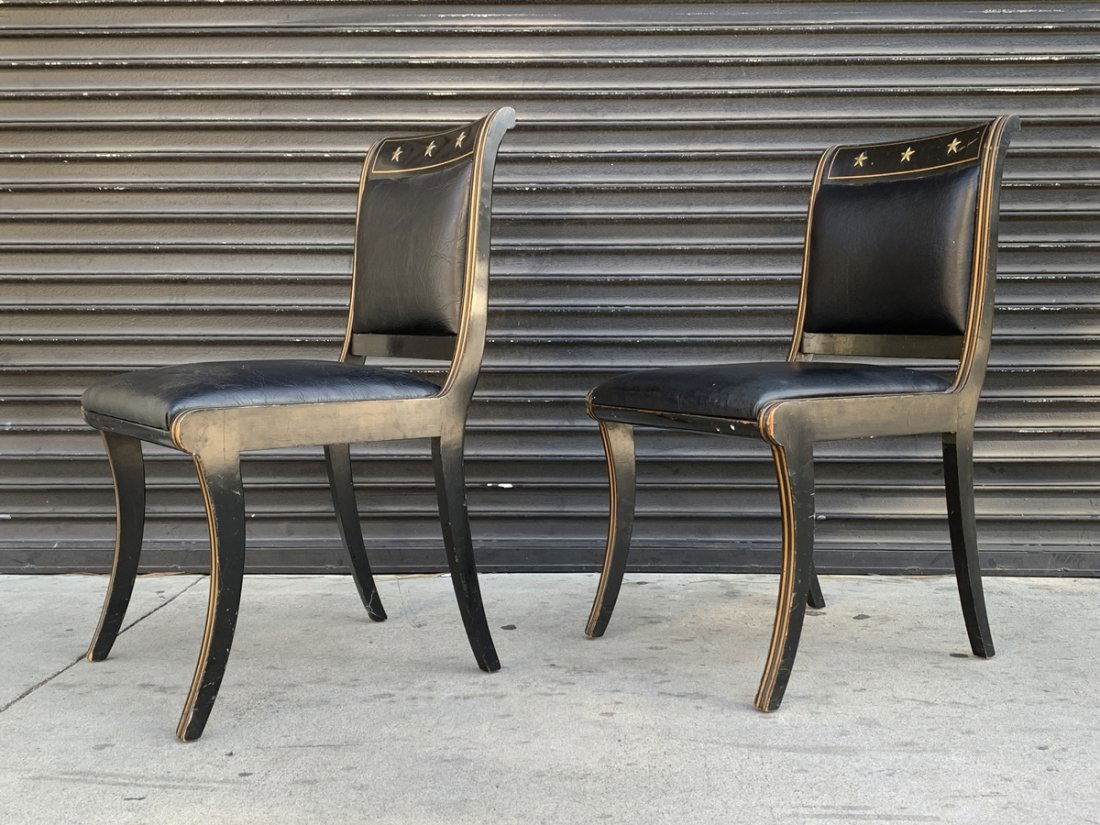 Pair of Vintage Side Chairs by Kittinger: Pair of vintage side chairs designed and manufactured in the United States by Kittinger.The chairs have black wooden frames with golden lines running along the edges of the chairs.These chairs are 70