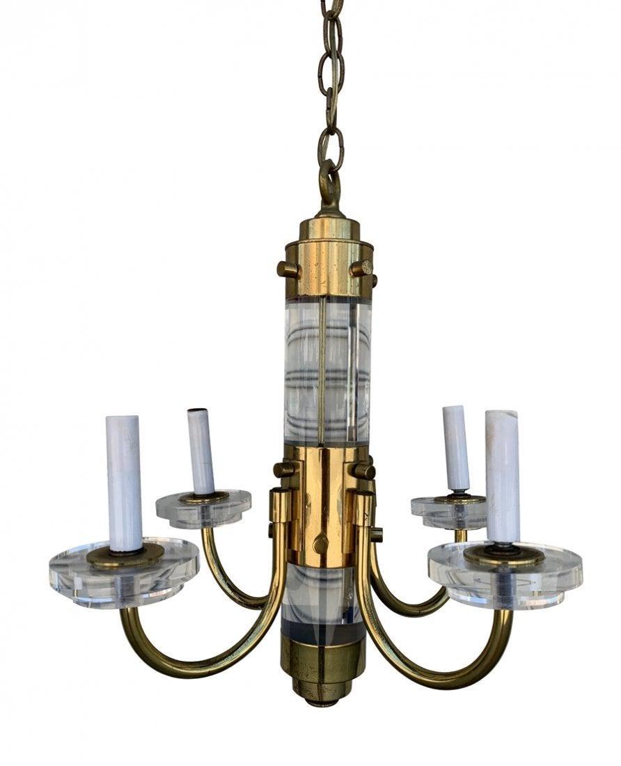 Brass & Lucite Chandelier by Frederick Cooper: Beautiful brass and Lucite chandelier designed and manufactured in the US by Frederick Cooper.The chandelier has 4 arms with a 3 inches Lucite center rod.The Lucite shows well, the brass is tarnished