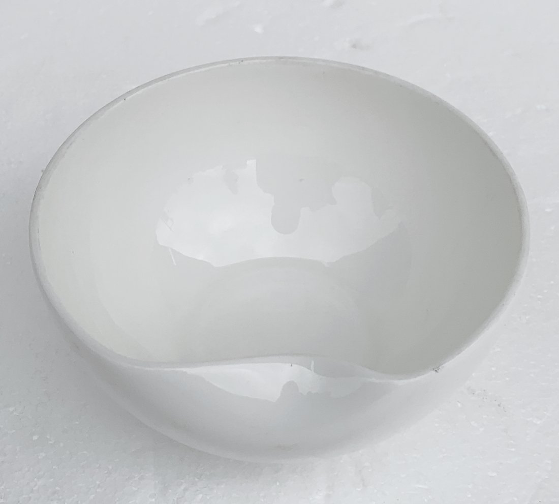 Elsa Peretti for Tiffany & Co. Thumbprint Bowl: TIFFANY & Co. WHITE THUMBPRINT FINGER BOWL DESIGNED BY ELSA PERETTI Marked on the bottom with hand inscribed script. The bowl measures 4.75 inches in diameter and 2 1/4 inches in height. This bowl fea