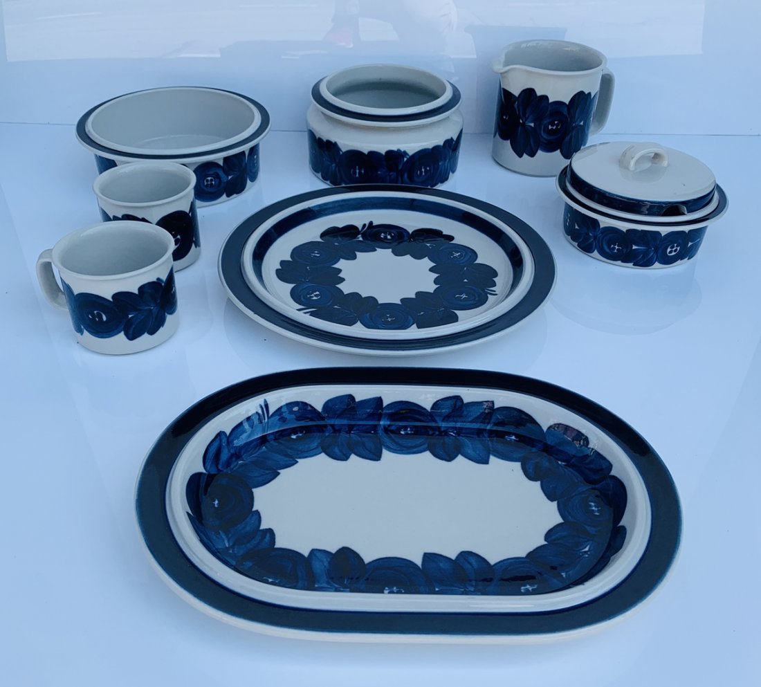 Set of 8 Hand Painted Serving Dishes by Arabia Finland: Set of 8 Anemone serving dishes hand-made and hand-painted by Ulla Procope for Arabia Finland.The set consists of one large round platter, one large oval platter, 2 coffee mugs, one beer pitcher, 2 se