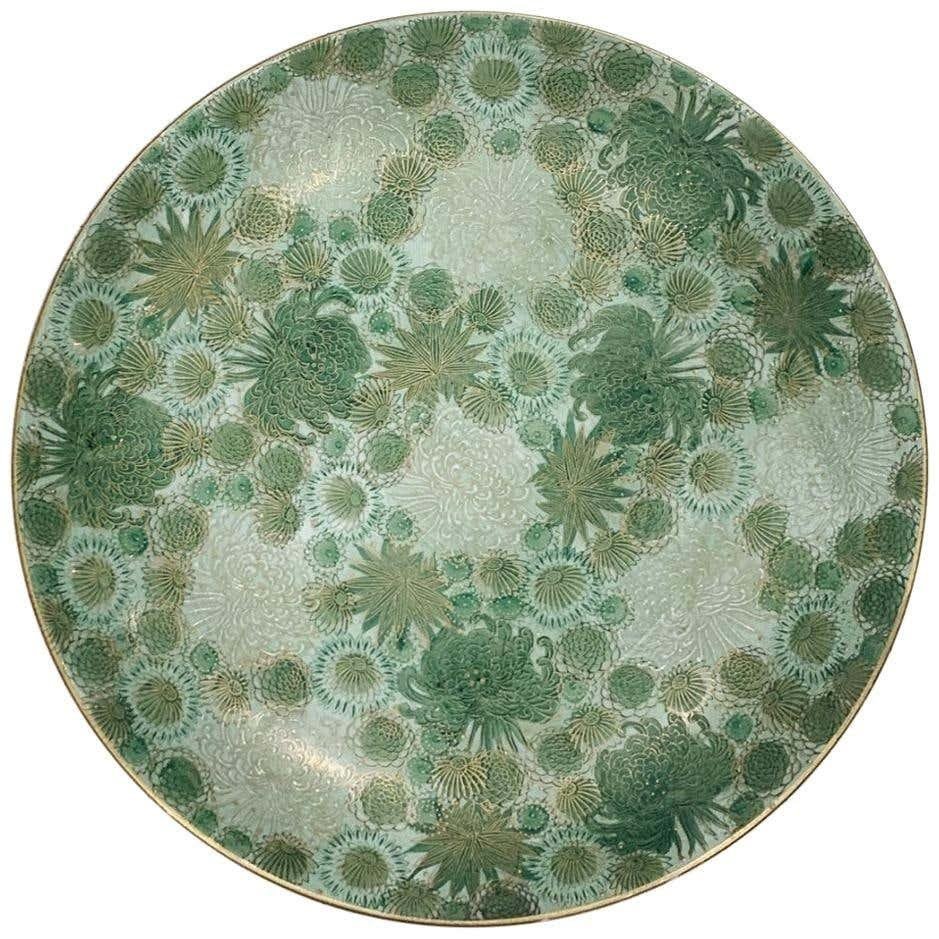 Vintage Japanese Plater/Charger Marked Genuine Kutani: Vintage or antique charger/plater made in Japan and marked Genuine Kutani.The piece has beautiful details, freeb foliage and flowers with gold accents.The piece is in excellent condition, no chips, or