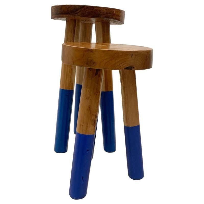 Pair of Wood Stools by Outlook International LTD: Beautiful pair of wooden stools by Outlook International LTD.The stools are made of thick solid wood, they are heavy and solid and in very good condition. Measurements: The taller one is 19.5 high x 9