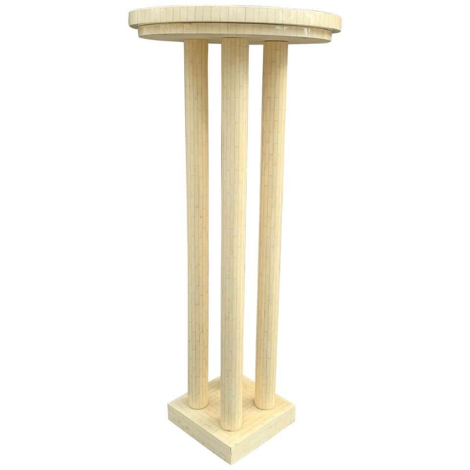 Tessellated Bone Pedestal/Table by Enrique Garcel: Beautiful and tall pedestal table designed and manufactured in Colombia by Enrique Garcel for Jimeco.The pedestal is done in tessellated bone tiles with a cream finish, heavily laquered surface having