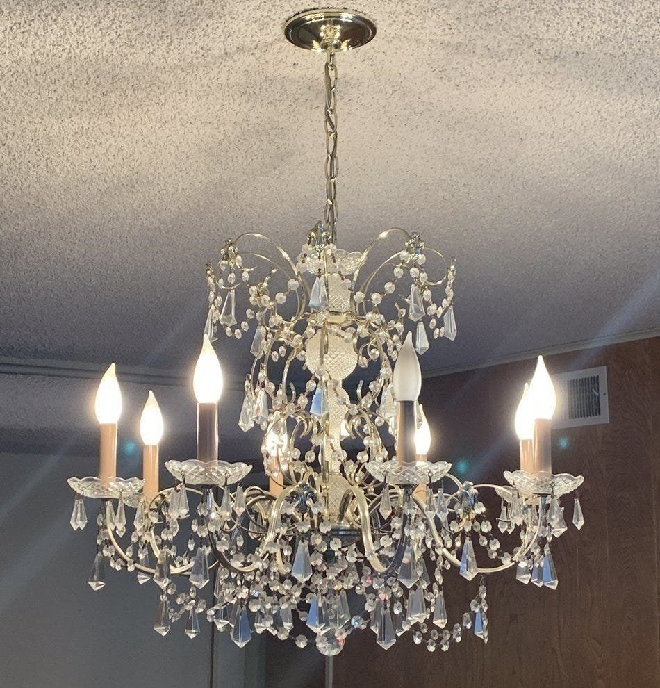 Vintage Brass Tone & Cut Glass Chandelier w/ 8 Lights: Beautiful chandelier in brass tone metal and cut glass.The piece is from the 1970's, all original and with only one owner since the 70's.Working condition. Measrements: 36 inches high x 28 inches in d