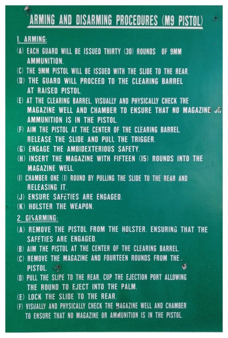 Large Metal Poster for Arming & Desarming an M9 Pistol: This is a large metal sign that came probably from a police academy or a shooting range. The sign provides safety procedures on how to arm and disarm an M9 pistol. The sign is old and has a few condit