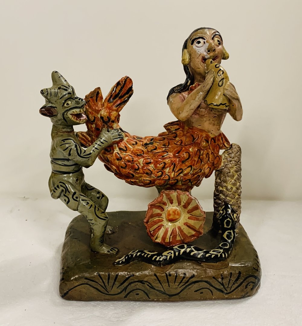 Diablo y Sirena, Ocumicho Pottery by Carmela Martinez: Diablito y Sirena (Little Devil & Mermaid) clay pottery signed Carmela Martinez Alvarez, Ocumicho, Michoacan, Mexico.The piece has beautul colors and attention to detail, this is a very old piece.The 