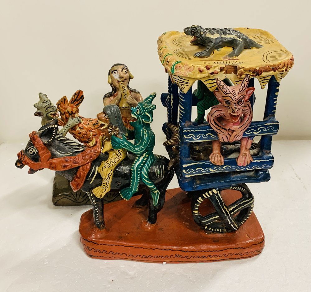 Carreta,Burro y Diablitos, Ocumicho Style Pottery: Beautiful clay pottery sculpture depicting a donkey pulling a wagon with little devils riding the donkey and the wagon.The piece is very colorful and with great detail.The piece is not signed but it c